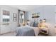 Cozy bedroom with soft blue accents, decorative skateboard art, and a peaceful view of the water at 314 Archar St, Summerville, SC 29486