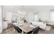 Bright, open dining room with a modern chandelier and stylish decor, connecting the kitchen and living area at 314 Archar St, Summerville, SC 29486