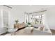 Bright, minimalist living room with sheer curtains and contemporary furniture arrangement at 314 Archar St, Summerville, SC 29486