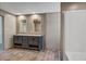 Bathroom features double vanity, tub and shower highlighted by wood-look floors at 317 Marion Rd, Dorchester, SC 29437