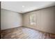 Bright bedroom features wood-look floors and large windows for natural light at 317 Marion Rd, Dorchester, SC 29437