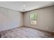 Bright bedroom with wood-look floors features a large window with natural views at 317 Marion Rd, Dorchester, SC 29437