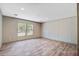 Bright bedroom features wood-look floors and large windows for natural light at 317 Marion Rd, Dorchester, SC 29437