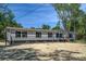 Single-story home boasts gray siding, black shutters, and a well-maintained front yard at 317 Marion Rd, Dorchester, SC 29437