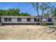 Charming single-story home with gray siding, black shutters, and a well-maintained front yard at 317 Marion Rd, Dorchester, SC 29437