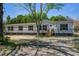 Single-story home boasts gray siding, black shutters, and a well-manicured front yard at 317 Marion Rd, Dorchester, SC 29437