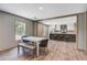 Open-concept dining and kitchen area with a large island and stainless steel appliances at 317 Marion Rd, Dorchester, SC 29437