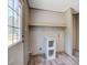 Convenient laundry room with storage shelves near a sunlit door at 317 Marion Rd, Dorchester, SC 29437