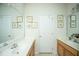 Bright bathroom featuring double sinks and beach-themed decorations on the walls at 320 Foxglove Ave, Summerville, SC 29483