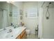 Bathroom with a white countertop, framed mirror, and a shower-tub combination at 320 Foxglove Ave, Summerville, SC 29483