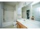 Well-lit bathroom featuring a shower-tub combo, large mirror and white countertops at 320 Foxglove Ave, Summerville, SC 29483