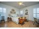 Bright bedroom featuring wood floors, two windows, and plenty of natural light at 320 Foxglove Ave, Summerville, SC 29483