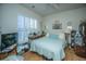 Bedroom with a bed, a window with blinds, and personal decorations at 320 Foxglove Ave, Summerville, SC 29483