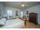Bedroom featuring wood floors, two windows, and a ceiling fan at 320 Foxglove Ave, Summerville, SC 29483