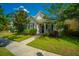 Charming single-Gathering home with a manicured lawn, mature trees, and inviting curb appeal at 320 Foxglove Ave, Summerville, SC 29483