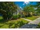 Charming home with well-maintained landscaping, a sidewalk, and a cozy porch at 320 Foxglove Ave, Summerville, SC 29483
