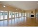 A spacious, bright hall with gleaming hardwood floors, many windows, and a cozy fireplace, ideal for gatherings and events at 320 Foxglove Ave, Summerville, SC 29483
