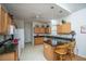 Bright kitchen featuring wood cabinets, black countertops, and modern appliances at 320 Foxglove Ave, Summerville, SC 29483