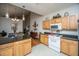 Bright kitchen featuring wood cabinets, black countertops, and breakfast bar at 320 Foxglove Ave, Summerville, SC 29483