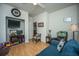Comfortable sitting area with laminate flooring, a sofa, and open doorway to the hall at 320 Foxglove Ave, Summerville, SC 29483