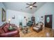 Bright living room featuring hardwood floors, vaulted ceilings, and comfortable seating arrangements at 320 Foxglove Ave, Summerville, SC 29483