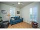 Cozy living room with comfortable seating, a ceiling fan, and natural light at 320 Foxglove Ave, Summerville, SC 29483