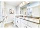 Bright bathroom features a double sink vanity, gray countertops, large mirror and shower with glass door at 3208 Pecan Orchard Way, Charleston, SC 29414