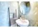 Charming powder room features stylish fixtures, a modern mirror, and unique wall texture for added character at 3208 Pecan Orchard Way, Charleston, SC 29414
