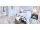 This light bedroom offers a metal frame bed, a plush rug and a bedside table, offering a serene retreat at 3208 Pecan Orchard Way, Charleston, SC 29414