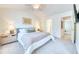 This bright bedroom has a plush bed and doorway to ensuite bathroom offering convenience and comfort at 3208 Pecan Orchard Way, Charleston, SC 29414