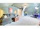 Large bonus room with seating, acoustic guitars, photography equipment and carpeted floors at 3208 Pecan Orchard Way, Charleston, SC 29414