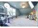 Comfortable bonus room boasts stylish decor, plush carpeting, and a well-lit setup suitable for work or leisure at 3208 Pecan Orchard Way, Charleston, SC 29414