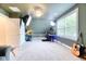 Spacious bonus room with angled ceiling, acoustic guitars, photography equipment and lots of light at 3208 Pecan Orchard Way, Charleston, SC 29414
