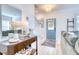 Inviting entryway with a stylish console table, decor, a staircase, and a charming door leading to the outside at 3208 Pecan Orchard Way, Charleston, SC 29414