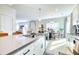 Kitchen with a large island, stainless steel appliances, and an open view into the dining area at 3208 Pecan Orchard Way, Charleston, SC 29414