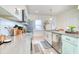 Spacious kitchen with white cabinets, stainless steel appliances, and a large island at 3208 Pecan Orchard Way, Charleston, SC 29414