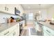 Contemporary kitchen with white cabinets, stainless steel appliances, and an island at 3208 Pecan Orchard Way, Charleston, SC 29414