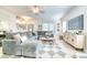 Spacious living room with a comfortable gray sectional sofa, modern furnishings, and plenty of natural light at 3208 Pecan Orchard Way, Charleston, SC 29414