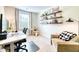 Bright office space with a cozy couch, black shelves, workstation and large window at 3208 Pecan Orchard Way, Charleston, SC 29414