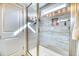 Bright bathroom features a glass enclosed shower with gray tile and recessed shelves at 3208 Pecan Orchard Way, Charleston, SC 29414