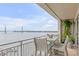 Balcony with dining area, featuring views of the harbor and iconic bridge at 330 Concord St # 18F, Charleston, SC 29401
