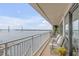 Relaxing balcony with seating area and stunning views of the waterway and bridge at 330 Concord St # 18F, Charleston, SC 29401