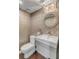 Modern powder room features chic wallpaper, decorative mirror, and a sleek vanity sink at 330 Concord St # 18F, Charleston, SC 29401