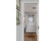Modern bathroom with sleek vanity, stylish mirror, and open doorway with art at 330 Concord St # 18F, Charleston, SC 29401