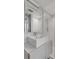 Bathroom featuring white vanity with sink, framed mirror, and shower with glass enclosure at 330 Concord St # 18F, Charleston, SC 29401