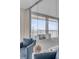 Elegant bedroom with water views, blue accents, and glass partitions at 330 Concord St # 18F, Charleston, SC 29401