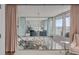 Second story view into a bedroom with access to a balcony with city views at 330 Concord St # 18F, Charleston, SC 29401