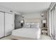 Bright, spacious bedroom features a plush bed with decorative pillows and side tables at 330 Concord St # 18F, Charleston, SC 29401