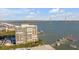 An exterior view of a high-rise condominium near the water and a bridge at 330 Concord St # 18F, Charleston, SC 29401