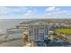 An exterior view of a high-rise condo building, a marina, and a city skyline at 330 Concord St # 18F, Charleston, SC 29401
